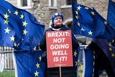 An anti-Brexit campaigner joins the noisy protests outside of parliament over Brexit. Getty