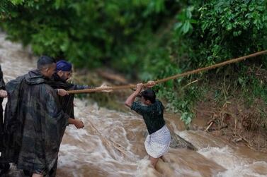 Indian military personnel conduct rescue operations in the flood affected areas in Belgaum/Belagavi district in North Karnataka, India. More than 80 have been killed in Kerala and Karnataka in flood-related incidents. EPA/INDIA INDIAN DEFENCE MINISTRY
