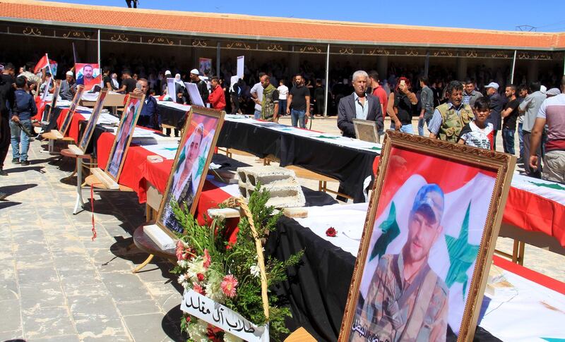 epa06914249 People attend the funeral processions for victims of the suicide bombings that hit al-Sweida province on 25 July and claimed the lives of dozens of people and injured scores others, al-Swaida, Southern Syria, 27 July 2018. According to media reports, a number of citizens were killed and others were injured in suicide bombing attacks in Swaida city synchronizing with Islamic State (IS) attacks on a number of villages in the eastern and northern countryside of the province on 25 July 2018.  EPA/STR