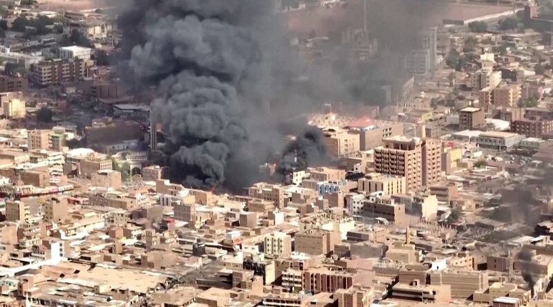 Black smoke and flames rise from a market in Omdurman, Sudan. Reuters