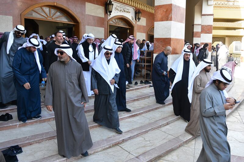 People leave after the funeral ceremony of the Emir of Kuwait. AP