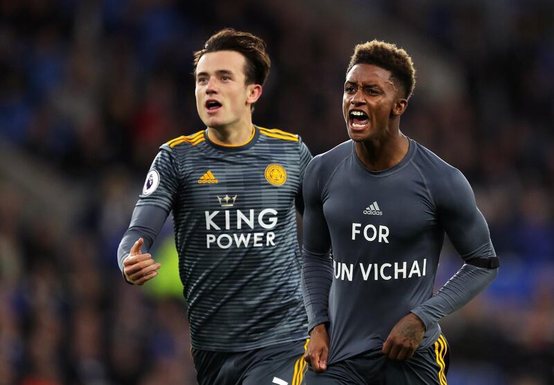 Demarai Gray of Leicester City celebrates with Ben Chilwell of Leicester City after scoring his team's first goal by revealing a commemorative for Vichai Srivaddhanaprabha during the Premier League match between Cardiff City and Leicester City at Cardiff City Stadium. Getty