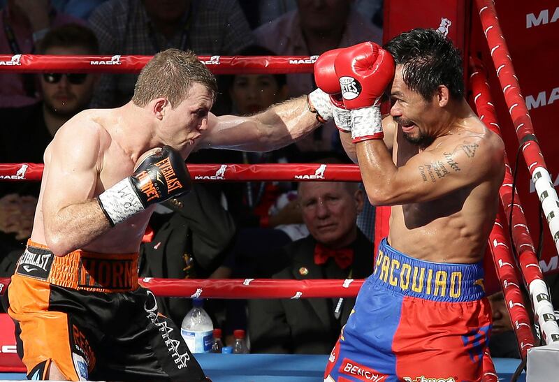 Jeff Horn of Australia, left, lands a left to Manny Pacquiao of the Philippines during their WBO World Welterweight title fight in Brisbane, Australia, Sunday, July 2, 2017. (AP Photo/Tertius Pickard)