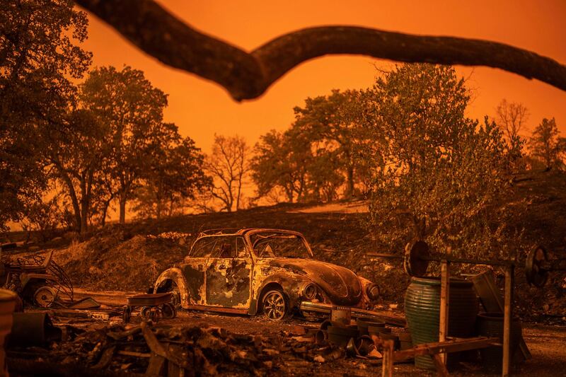 A Volkswagen Beetle scorched by a wildfire called the Carr Fire rests at a residence in Redding, California. AP Photo / Noah Berger