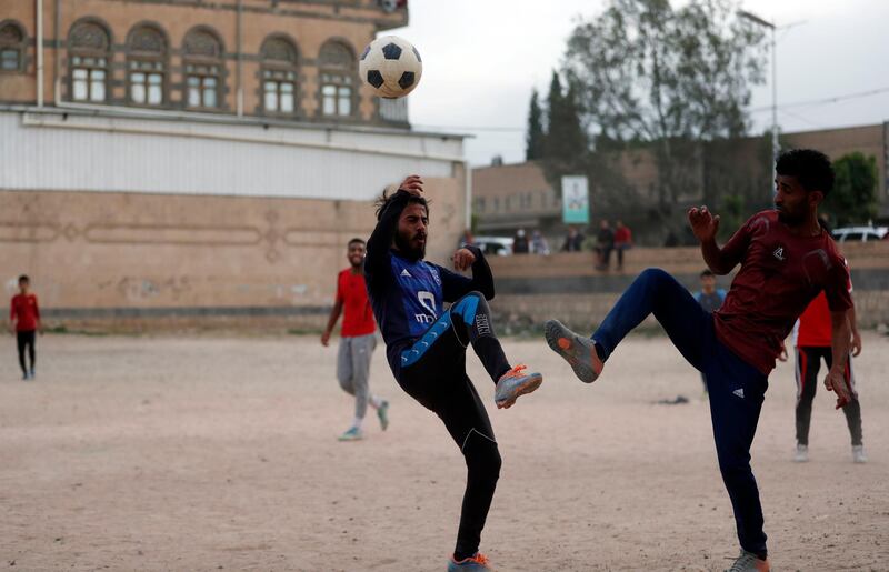 Yemeni youth take part in a football match despite the threats of the ongoing coronavirus COVID-19 pandemic in Sanaa, Yemen.  EPA