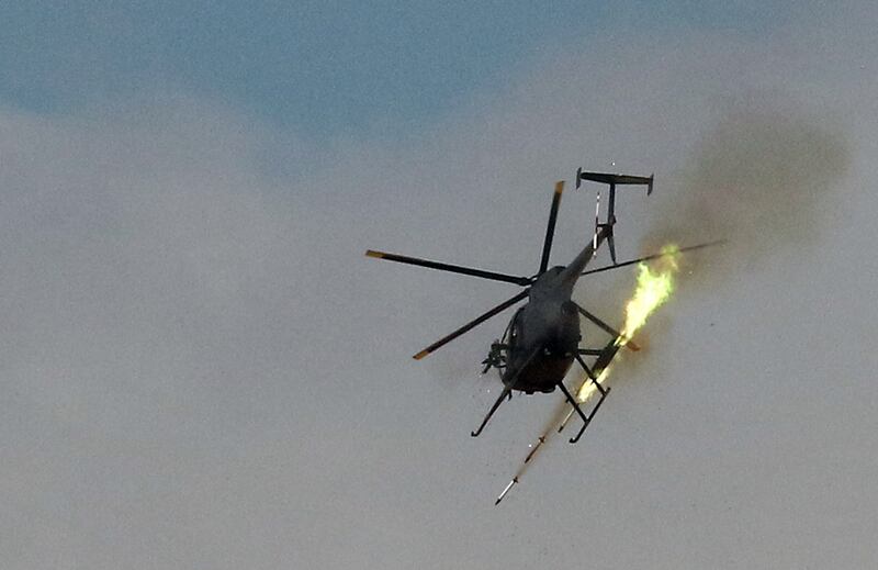 A US helicopter fires unguided rockets. AFP