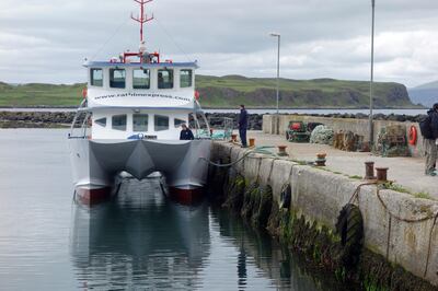 The catamaran passenger ferry, the Rathlin Express, is moored in Church Bay Harbour Marina at Rathlin Island.