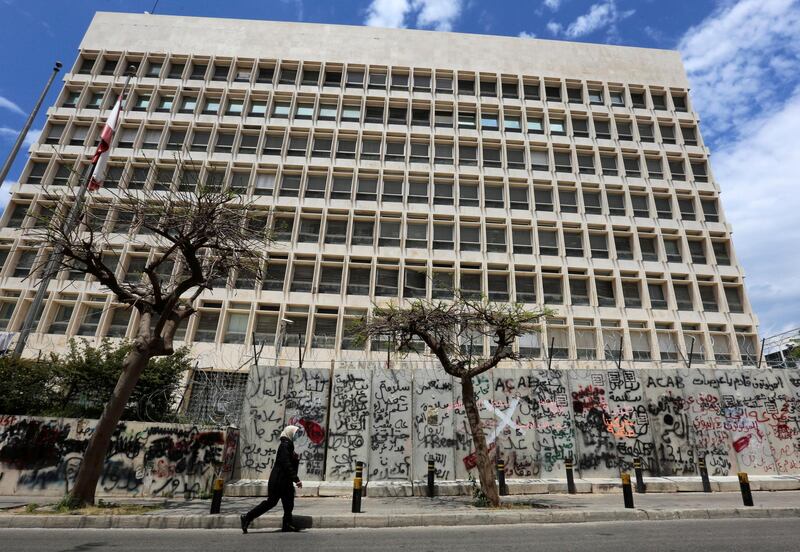 FILE PHOTO: A woman wearing a protective mask walks past Central Bank building as Lebanon extends a shutdown to curb the spread of the coronavirus disease (COVID-19) in Beirut, Lebanon, May 5, 2020. REUTERS/Aziz Taher/File Photo