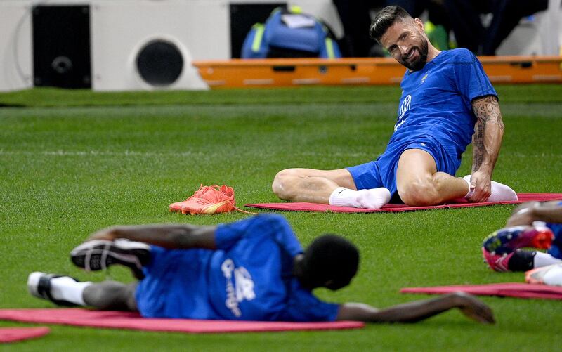 France's Olivier Giroud stretches at the end of the training session in Doha. AFP