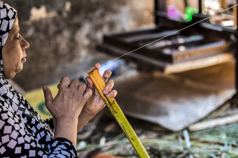 In the 1970s, a plastic arts teacher taught the farmers how to reappropriate agricultural and artistic techniques dating back millenia to plant the valuable reed and transform it into brownish paper with ornate drawings and text.