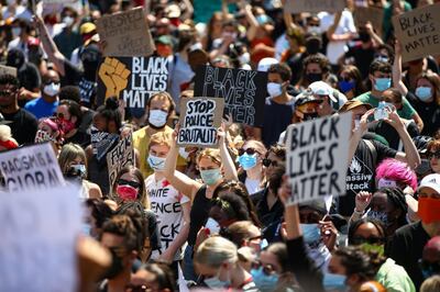 LONDON, ENGLAND - MAY 31: People hold placards as they join a spontaneous Black Lives Matter march at Trafalgar Square to protest the death of George Floyd in Minneapolis and in support of the demonstrations in North America on May 31, 2020 in London, England. The death of an African-American man, George Floyd, at the hands of police in Minneapolis has sparked violent protests across the USA. A video of the incident, taken by a bystander and posted on social media, showed Floyd's neck being pinned to the ground by police officer, Derek Chauvin, as he repeatedly said "I cant breathe". Chauvin was fired along with three other officers and has been charged with third-degree murder and manslaughter. (Photo by Hollie Adams/Getty Images)