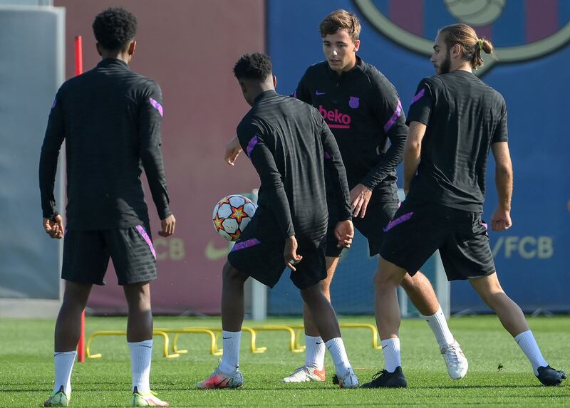 Barcelona's Riqui Puig and teammates take part in a training session ahead of their Champions League first round match against Dynamo Kiev. AFP
