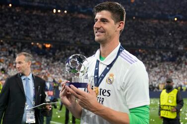 Real Madrid's goalkeeper Thibaut Courtois holds the Man of the Match award after the Champions League final soccer match between Liverpool and Real Madrid at the Stade de France in Saint Denis near Paris, Saturday, May 28, 2022.  (AP Photo / Frank Augstein)