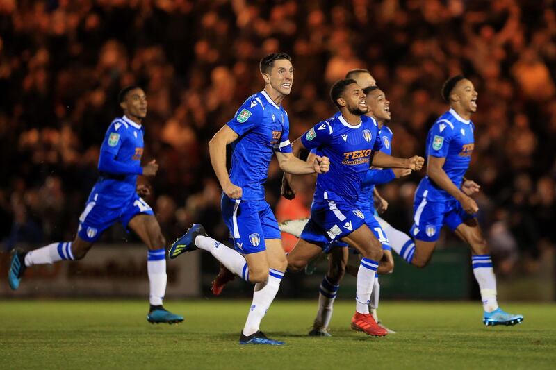 COLCHESTER, ENGLAND - SEPTEMBER 24: Colchester United celebrate victory in the penalty shoot out during the Carabao Cup Third Round match between Colchester United and Tottenham Hotspur at JobServe Community Stadium on September 24, 2019 in Colchester, England. (Photo by Stephen Pond/Getty Images)