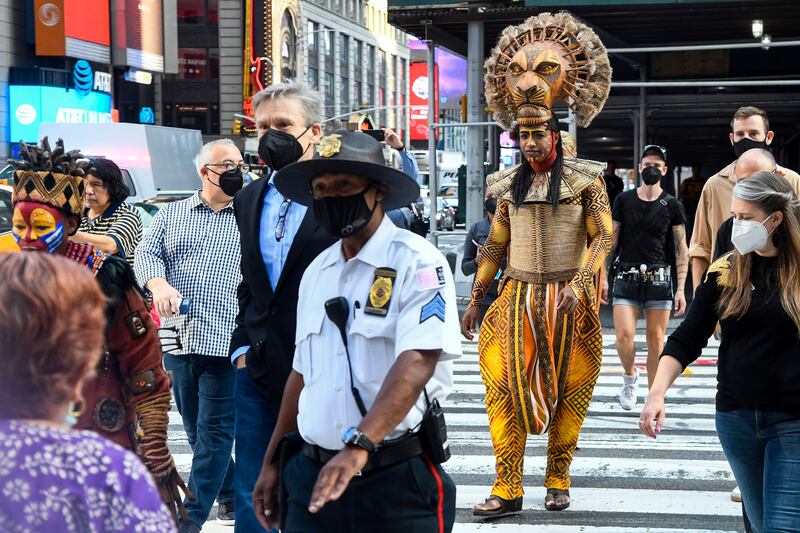 Costumed cast members of Broadway's 'The Lion King' appear in Times Square to herald the return of Broadway theatre in New York City. AP