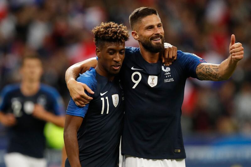 France's Kingsley Coman, left, celebrates his second goal with France's Olivier Giroud during the Euro 2020 group H qualifying soccer match between France and Albania at the Stade de France in Saint Denis, north of Paris, France, Saturday, Sept. 7, 2019. (AP Photo/Christophe Ena)