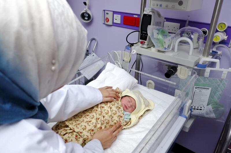 Newborn Aya Hamdan being cared for soon after her birth at Sheikh Khalifa General Hospital in Umm Al Quwain last week. Antonie Robertson / The National