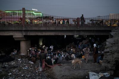 Afghans gather under a bridge to take drugs, mostly heroin and methamphetamines, in Kabul. AP