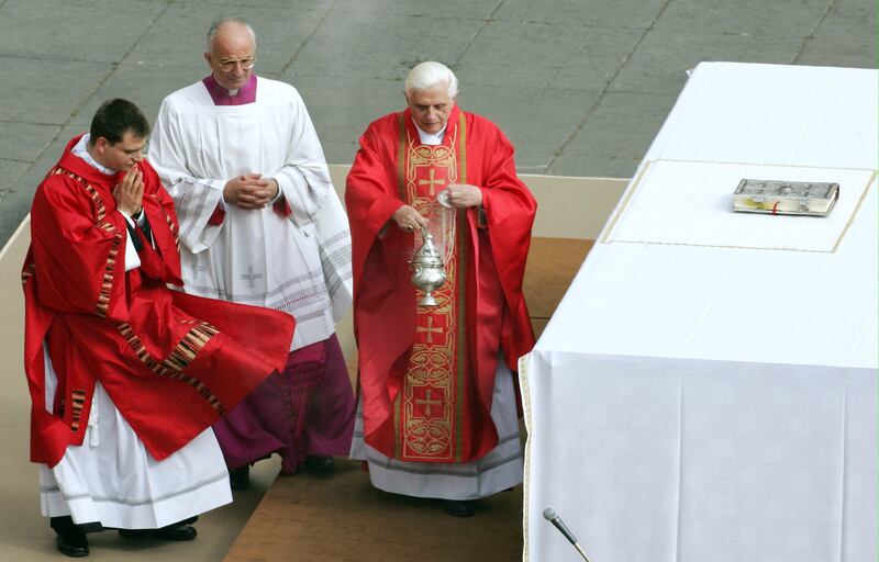 Cardinal Ratzinger, centre, arrives to lead the funeral mass for Pope John Paul II in St Peter's Square at the Vatican City in 2005. AFP 