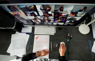 A student takes classes online with his companions using the Zoom APP at home during the coronavirus disease (COVID-19) outbreak in El Masnou, north of Barcelona, Spain April 2, 2020. REUTERS/ Albert Gea     TPX IMAGES OF THE DAY