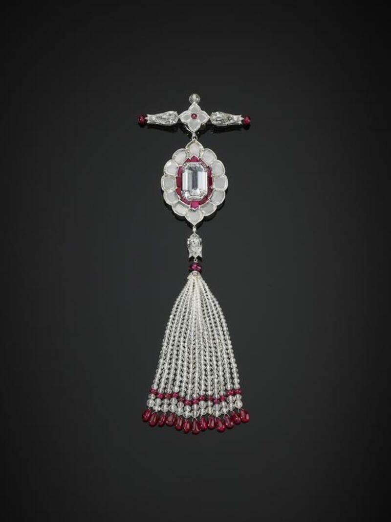 A pendant brooch set with diamonds and rubies. Prudence Cuming Associates