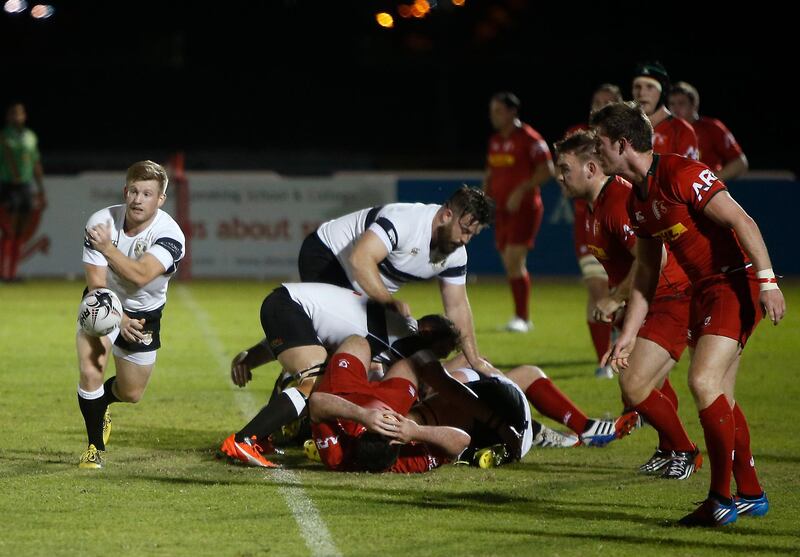 DUBAI - UNITED ARAB EMIRATES - 07OCT2016 - Dubai Exiles and Bahrain (in red) tussels for the ball in the West Asia Premiership rugby match yesterday at The Sevens, rugby grounds in Dubai. Ravindranath K / The National (to go with Paul Radley story for Sports) ID: 74521 *** Local Caption ***  RK0710-Rugby10.jpg