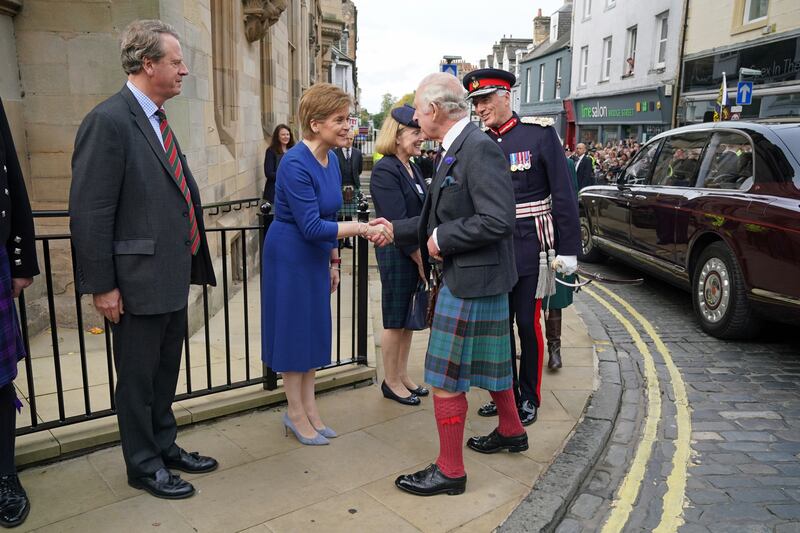 King Charles shakes hands with First Minister Nicola Sturgeon as he arrives at the City Chambers in Dunfermline. PA