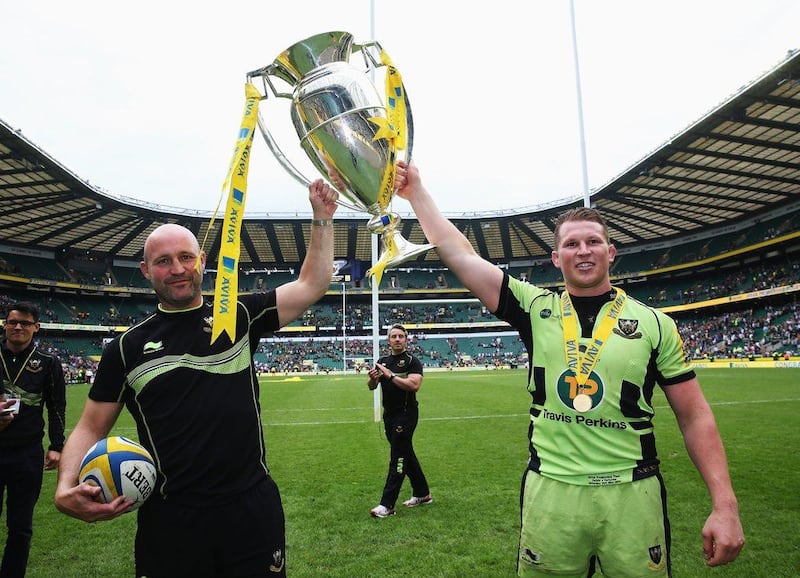 Northampton Saints' Alex King and Dylan Hartley lift the Aviva Premiership trophy after their win over Saracens in the competition's final on Saturday. David Rogers / Getty Images / May 31, 2014