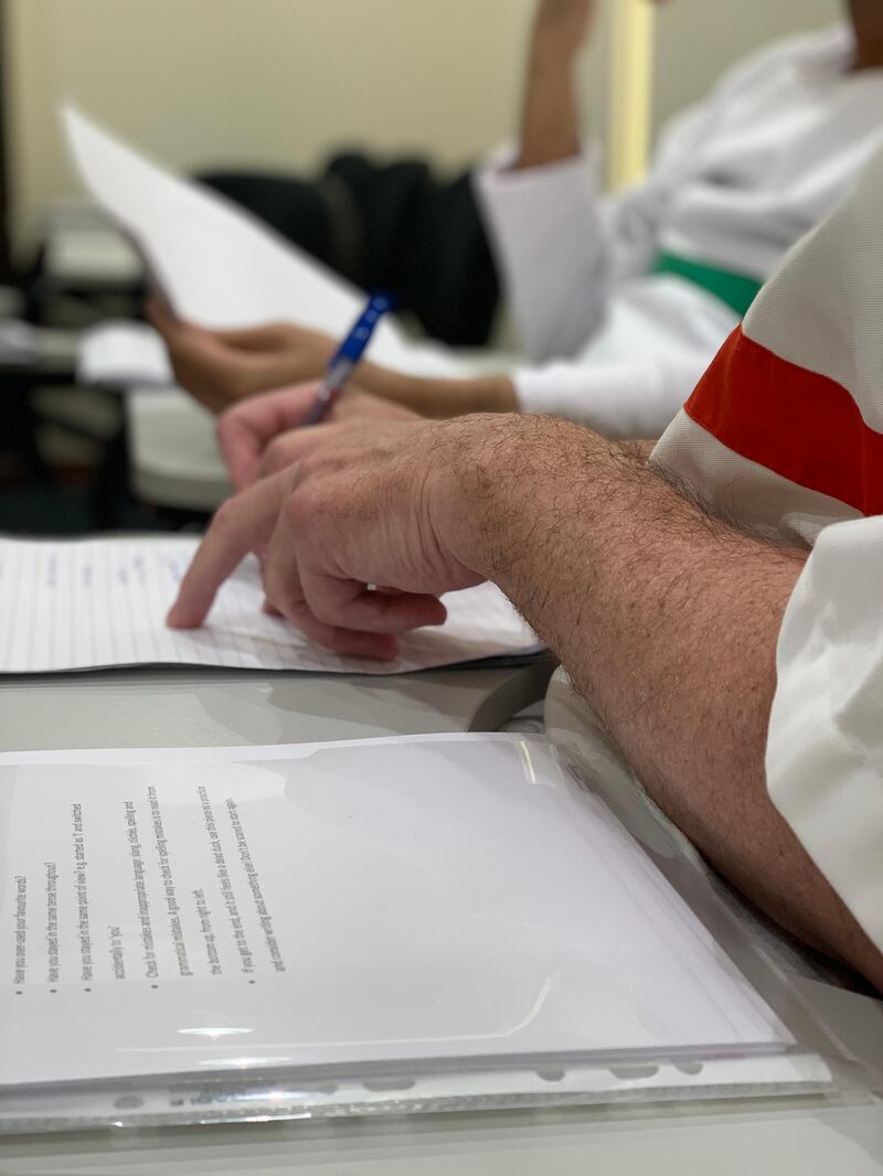 Inmates at Dubai prison working on their pieces for the novel. Courtesy Emirates Airline Festival of Literature