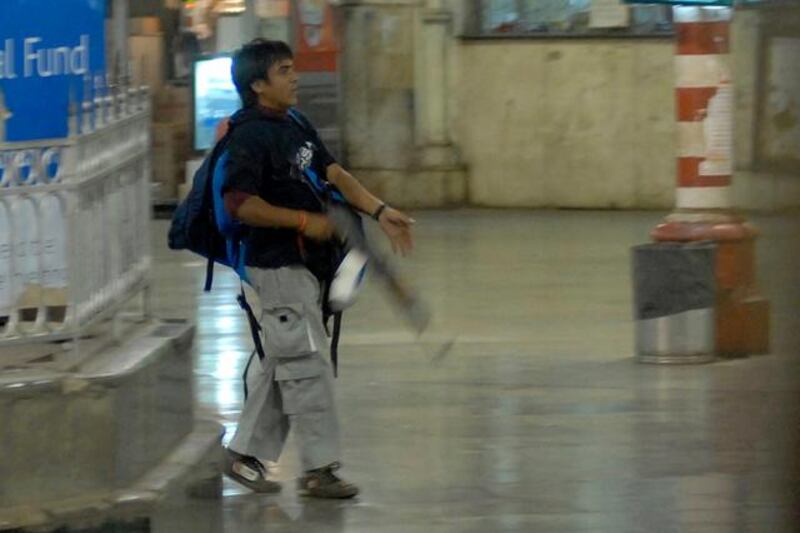 FILE - In this Nov. 26, 2008 file photo, Ajmal Kasab, one of the accused gunmen, walks at the Chatrapathi Sivaji Terminal railway station in Mumbai, India. India executed the lone surviving gunman from the 2008 terror attack on Mumbai early Wednesday, Nov. 21, 2012, India's home ministry said. Kasab, a Pakistani citizen, was one of 10 gunmen who rampaged through the streets of India's financial capital in November 2008, killing 166 people. Kasab was hung at a jail in Pune, a city near Mumbai, after India's president rejected his plea for mercy.(AP Photo/Mumbai Mirror, Sebastian D'souza, File) FULL CREDIT MANDATORY, INDIA OUT