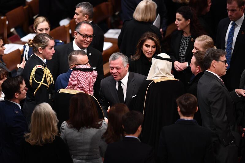 Jordan's King Abdullah II, centre, and Queen Rania arrive before the funeral service. AFP