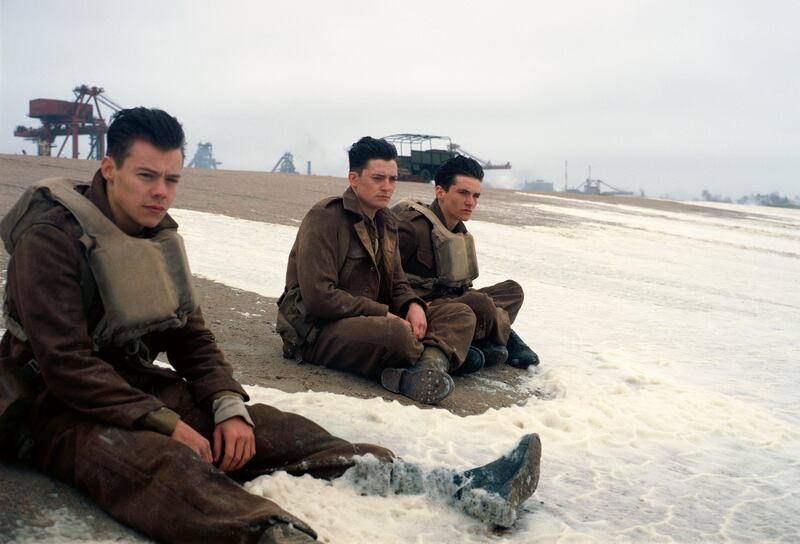 This image released by Warner Bros. Pictures shows Harry Styles, from left, Aneurin Barnard and Fionn Whitehead in a scene from "Dunkirk." (Warner Bros Pictures via AP)