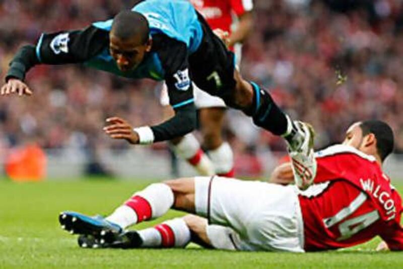 Ashley Young is sent flying by Theo Walcott to earn a penalty which he took himself and missed.