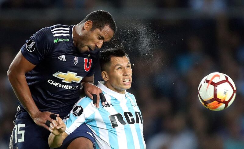 Universidad de Chile's Jean Beausejour and Racing Club's Leonardo Sigali in action during their Copa Libertadores match in Buenos Aires, Argentina. Marcos Brindicci / Reuters