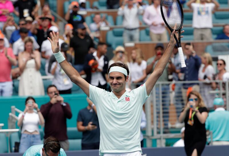 Roger Federer, of Switzerland, reacts after defeating John Isner in the singles final of the Miami Open tennis tournament, Sunday, March 31, 2019, in Miami Gardens, Fla. (AP Photo/Lynne Sladky)