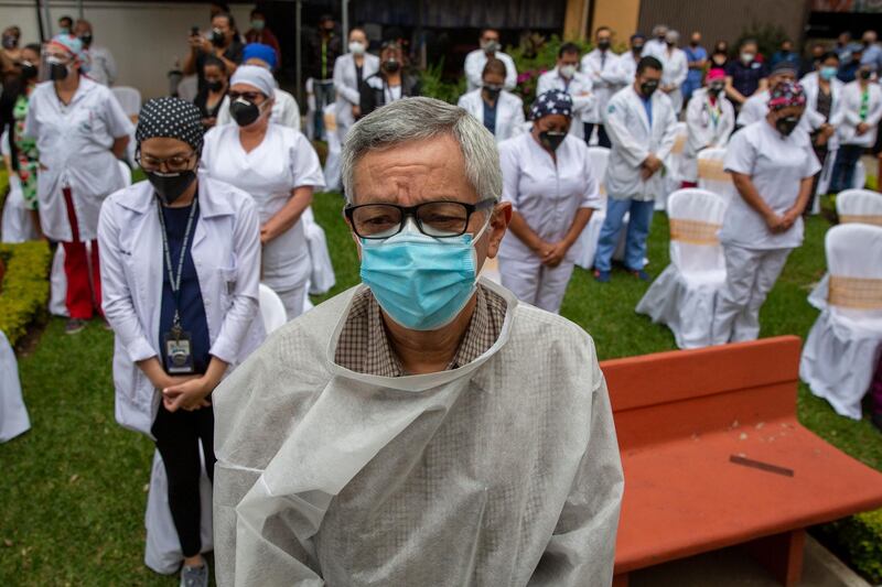 Health workers at the San Juan de Dios hospital observe a minute of silence in memory of their colleagues who have fallen victim to Covid-19, at the hospital in Guatemala City. AP Photo