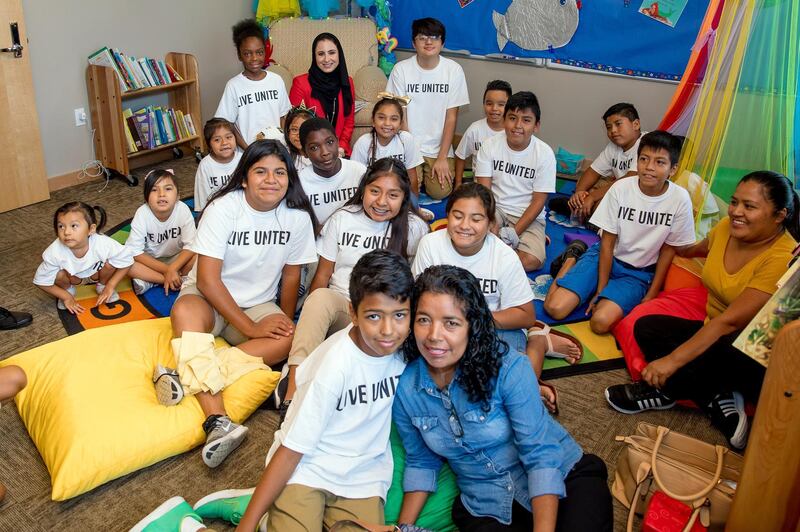 Dana Al Marashi, head of heritage and social affairs at the UAE Embassy in the US, meets pupils of Grace Place Naples - one of the recipients of the UAE's donation. Courtesy UAE Embassy in US