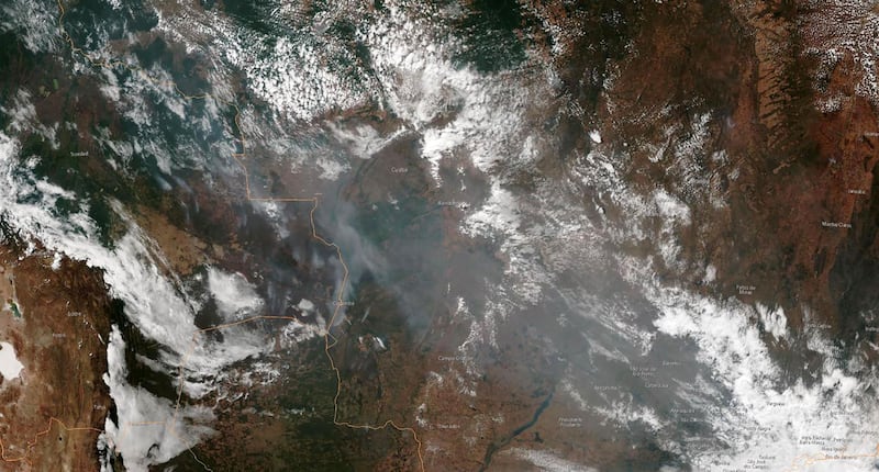 This satellite image obtained courtesy of the National Oceanic and Atmospheric Administration (NOAA) shows the smoke of several fires in the Brazilian states of Amazonas (top C-L), Para (top R), Mato Grosso (bottom R) and Rondonia (bottom C).  Wildfires in the Amazon rainforest in northern Brazil have ignited a firestorm on social media, with President Jair Bolsonaro  suggesting green groups started the blazes.  AFP