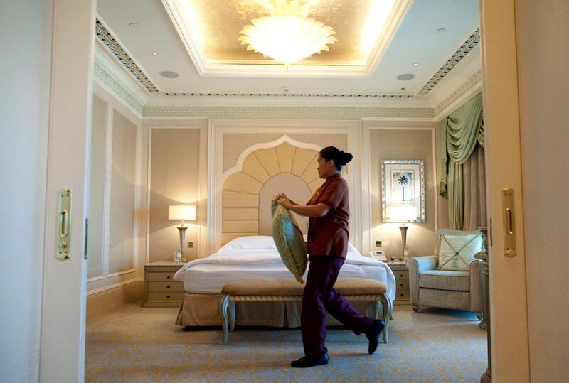 Abu Dhabi, United Arab Emirates, July 15, 2013:     Room Attendant Acting supervisor Annabelle Guevarra makes the bed in a suite at Emirates Palace in Abu Dhabi on July 15, 2013. Christopher Pike / The National

Reporter: GILLIAN DUNCAN *** Local Caption ***  CP0715-emirates palace016.JPG