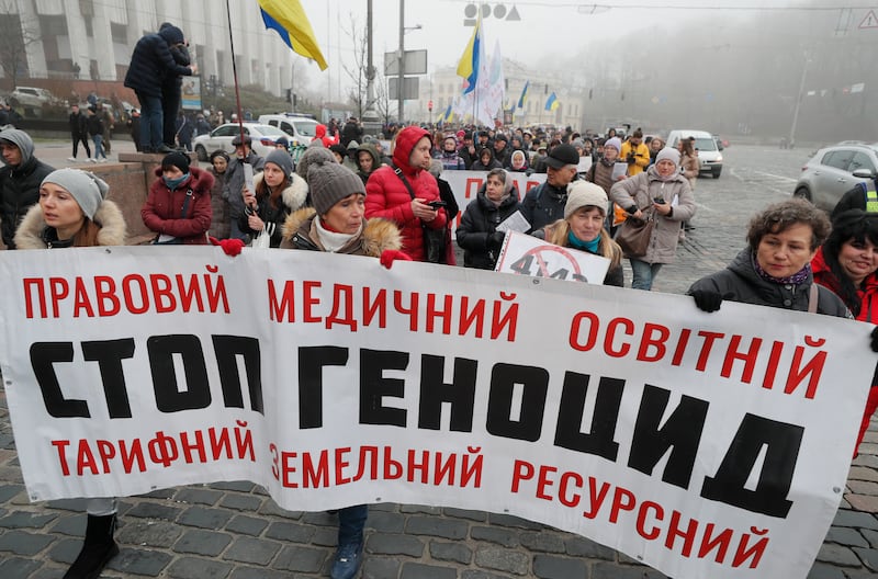 Ukrainians take part in a protest against Covid-19 restrictions for unvaccinated people in Kiev. EPA