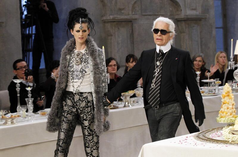 Karl Lagerfeld and  Stella Tennant walk the runway for the finale of the Chanel Metiers d'Art Pre-Fall show, December 2016. AFP