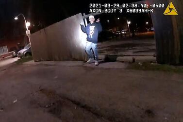 In this still from police body camera footage, Adam Toledo, 13, holds up his hands a split second before he was shot by police in Little Village, Chicago. Reuters