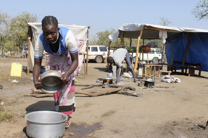 A South Sudanese refugee cooks food at a restaurant in the Bidi Bidi refugee camp in Uganda. Justin Lynch / AP Photo / December 13, 2016