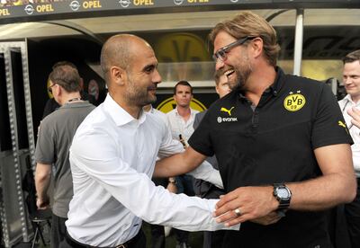 Pep Guardiola and Jurgen Klopp when they were managers of Bundesliga sides Bayern Munich and Borussia Dortmund in 2013. Getty Images 