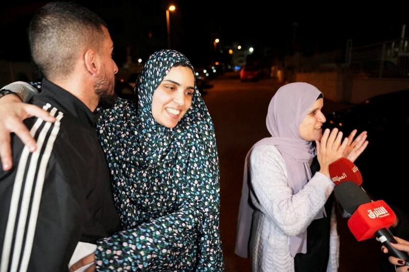 Ms Bakir embraces a family member after her release. Reuters