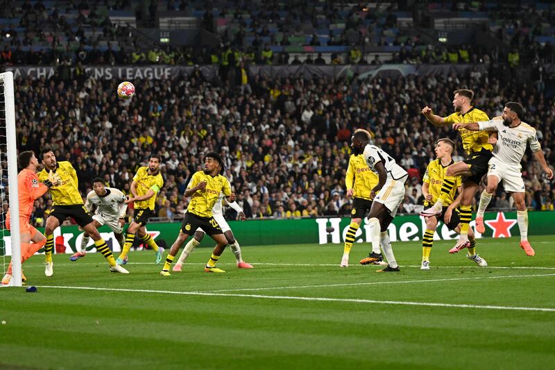 Real Madrid defender Dani Carvajal scores Real Madrid's opening goal with a header. AFP