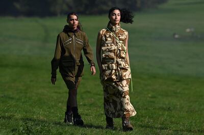 Models present creations from London-based designer Paria Farzaneh during a presentation for her Spring/Summer 2021 collection, during London Fashion Week in Amersham, north-west of London, on September 20, 2020. / AFP / Ben STANSALL
