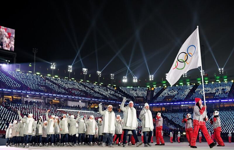 PYEONGCHANG-GUN, SOUTH KOREA - FEBRUARY 09:  Flag bearer  POCPG Volunteer of Olympic Athletes from Russia and teammates enter the stadium during the Opening Ceremony of the PyeongChang 2018 Winter Olympic Games at PyeongChang Olympic Stadium on February 9, 2018 in Pyeongchang-gun, South Korea.  (Photo by Matthias Hangst/Getty Images)