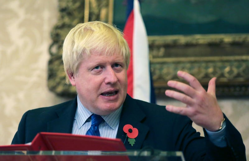 FILE - In this file photo dated Friday, Oct. 27 2017, Britain's Foreign Secretary Boris Johnson gestures during a joint news conference with Portuguese Foreign Minister Augusto Santos Silva following their meeting at the Necessidades palace, the Portuguese foreign ministry, in Lisbon.  Johnson and Richard Ratcliffe, the husband of British woman Nazanin Zaghari-Ratcliffe who remains imprisoned in Iran, spoke by phone Sunday, Nov. 12, 2017, but did not release details of the conversation. (AP Photo/Armando Franca, FILE)