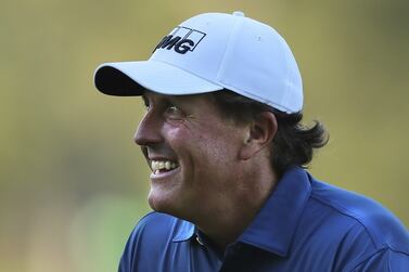Phil Mickelson smiles after chipping it in for an eagle on the third hole during a practice round ahead of the Masters golf tournament on April 4, 2017, in Augusta, Georgia. Curtis Compton / AP